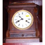 An Ansonia early 19th century mantel clock in walnut case and two mid 20th century mantel clocks