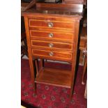 An Edwardian inlaid mahogany music cabinet, fitted four drawers and undershelf, 22" wide