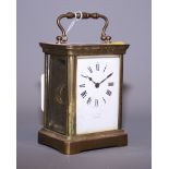 A brass cased carriage clock with white enamel dial signed J.C. Vickery London (a/f)