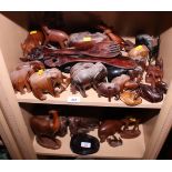 A collection of carved wooden animals and bookends