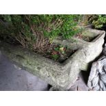 A pair of cast stone planters with Sphinx design, 26" wide, and three rectangular cast stone