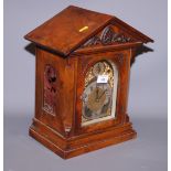 An early 20th century walnut cased bracket clock with brass and silvered dial, 15" high