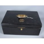 A Victorian black morocco leather writing box by Leuchars & Son with brass carrying handle