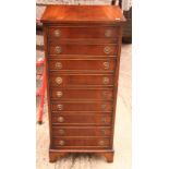 A Georgian design mahogany chest of nine drawers with gilt ring handles, 17" wide