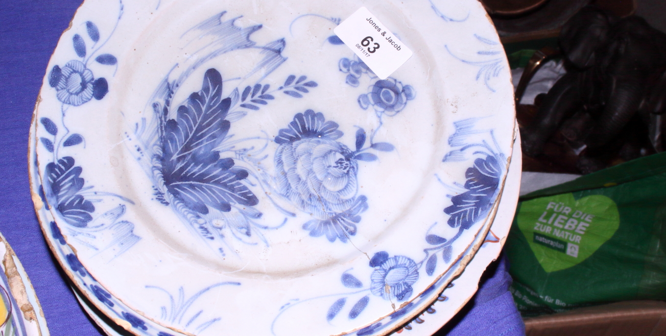 Five early Delft pottery plates, each of a different design, (all with chips to rim), 8 3/4" dia,