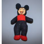 An early 20th century felt bodied and celluloid faced doll of Mickey Mouse, 10" high