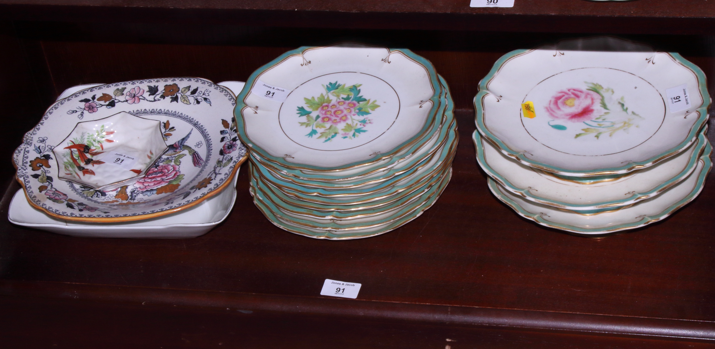 A 19th century floral decorated bone china part dessert service, nine plates and three stands and