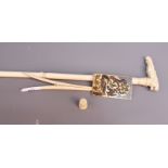 An early 20th century carved ivory walking cane, the handle in the form of an elephant's head and