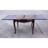 A French late 19th century fruitwood draw leaf dining table, on cabriole supports, 45" x 78" when