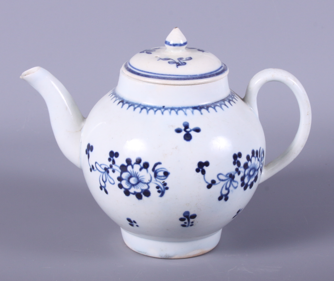 A 19th century Liverpool porcelain globular-shaped teapot, decorated with sprigs of flowers, 7 1/