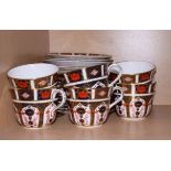 A set of eight Royal Crown Derby breakfast cups with matching saucers and side plates, pattern 1128