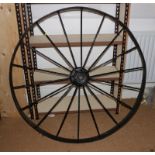 A 19th century wrought iron wheel with flat broad rim, 46" dia