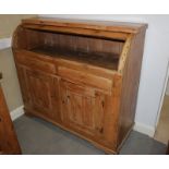 A 19th century stripped pine cylinder front bureau, fitted two frieze drawers and lower cupboard,