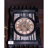 A late 19th century ebonised and decorated mantel clock, Gothic design with eight-day striking