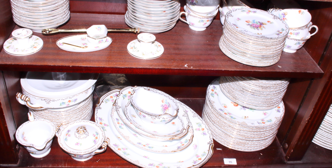 A Noritake floral decorated part combination service for twelve, ninety pieces approx