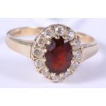 A 9ct yellow gold garnet and white sapphire cluster ring, size J