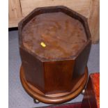 A circular figured walnut cabinet, fitted cupboard, and an octagonal stained wooden plinth, on