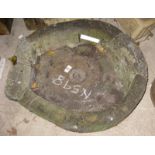 A stone circular sink, 23" wide