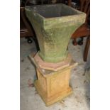 A cast stone terracotta colour pedestal, a shaped terracotta stand and an octagonal stand