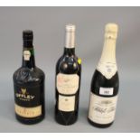 A bottle of Offley port, another bottle of port and a bottle of Schloss Frier sparkling table wine