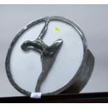 A circular chrome wall light decorated silhouette of a lady