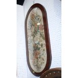 A late 19th century needlepoint panel, flowers, 19" x 29", in oval mahogany frame