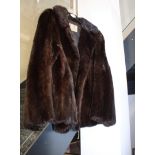 A Calman Links of London dark brown fur, possibly mink, half length coat