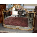 A wall mirror, in ornate scroll decorated gilt frame, 47" x 60"