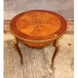 A Louis XV circular marquetry decorated coffee table with gilt metal mounts, 26" dia