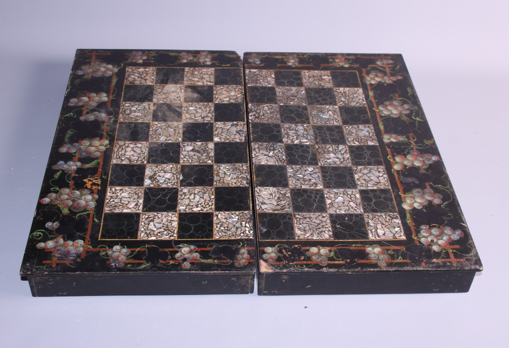 A collection of box and ebony chess pieces, various, and a mother-of-pearl inlaid chess and