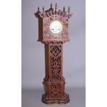 A miniature long case clock in fretted wooden case, 29" high