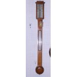A 19th century oak cased stick barometer and thermometer with silvered register plate engraved "