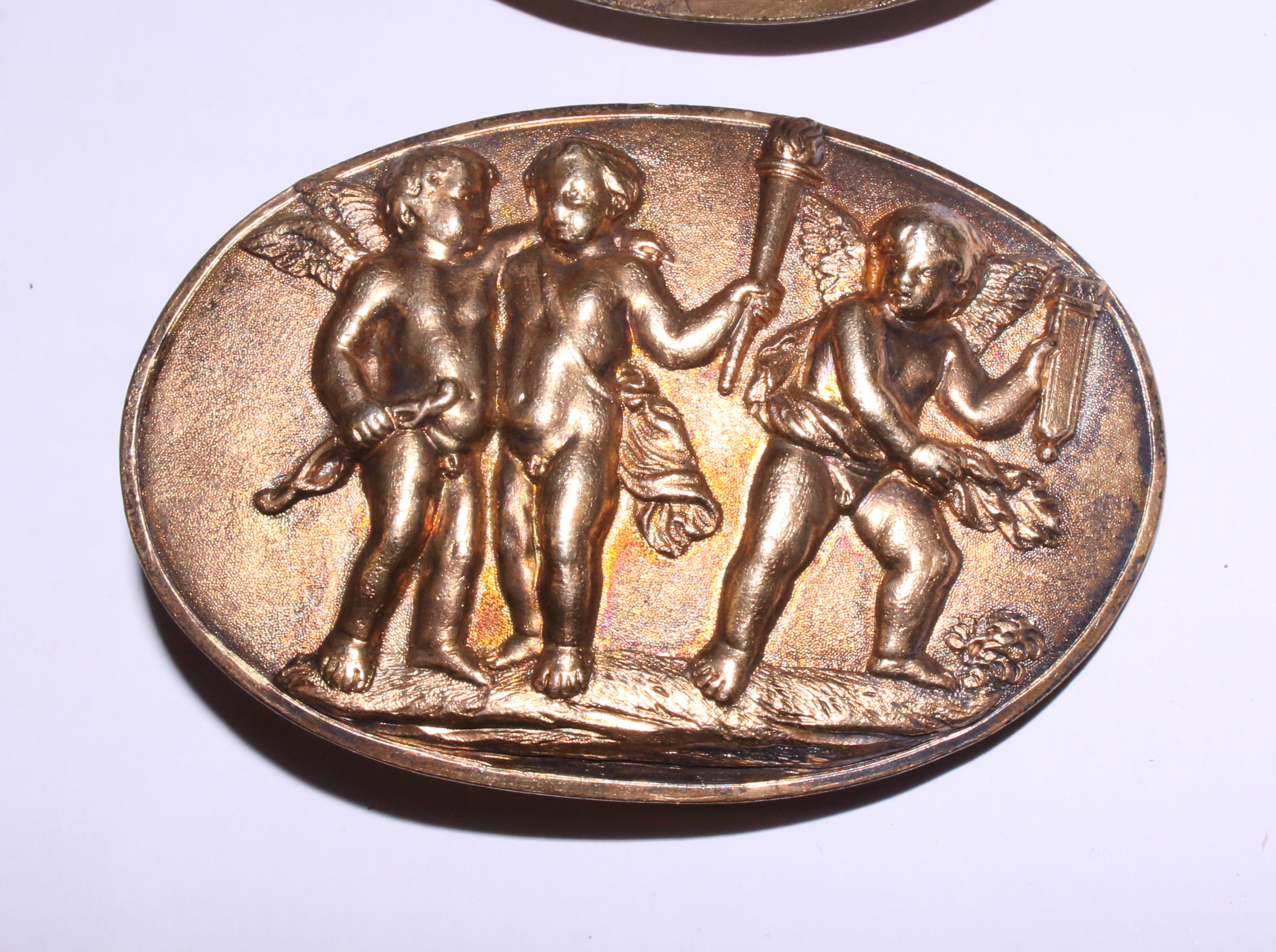 A pair of 19th century gilt metal oval brooches, panels with cherubs and Putti, 2 3/4" x 1 1/4" - Image 3 of 4