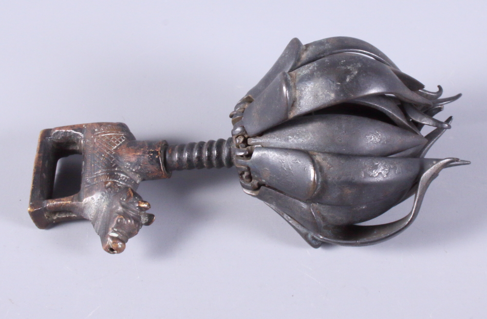 An Indian? metal travelling reliquary and an 18th century iron key