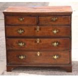 An early 18th century oak chest of two short and three long drawers, fitted brass handles,