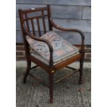 A 19th century mahogany carver chair with rail back and upholstered seat panel