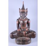 A carved and painted wooden figure of a seated Buddha, 32" high