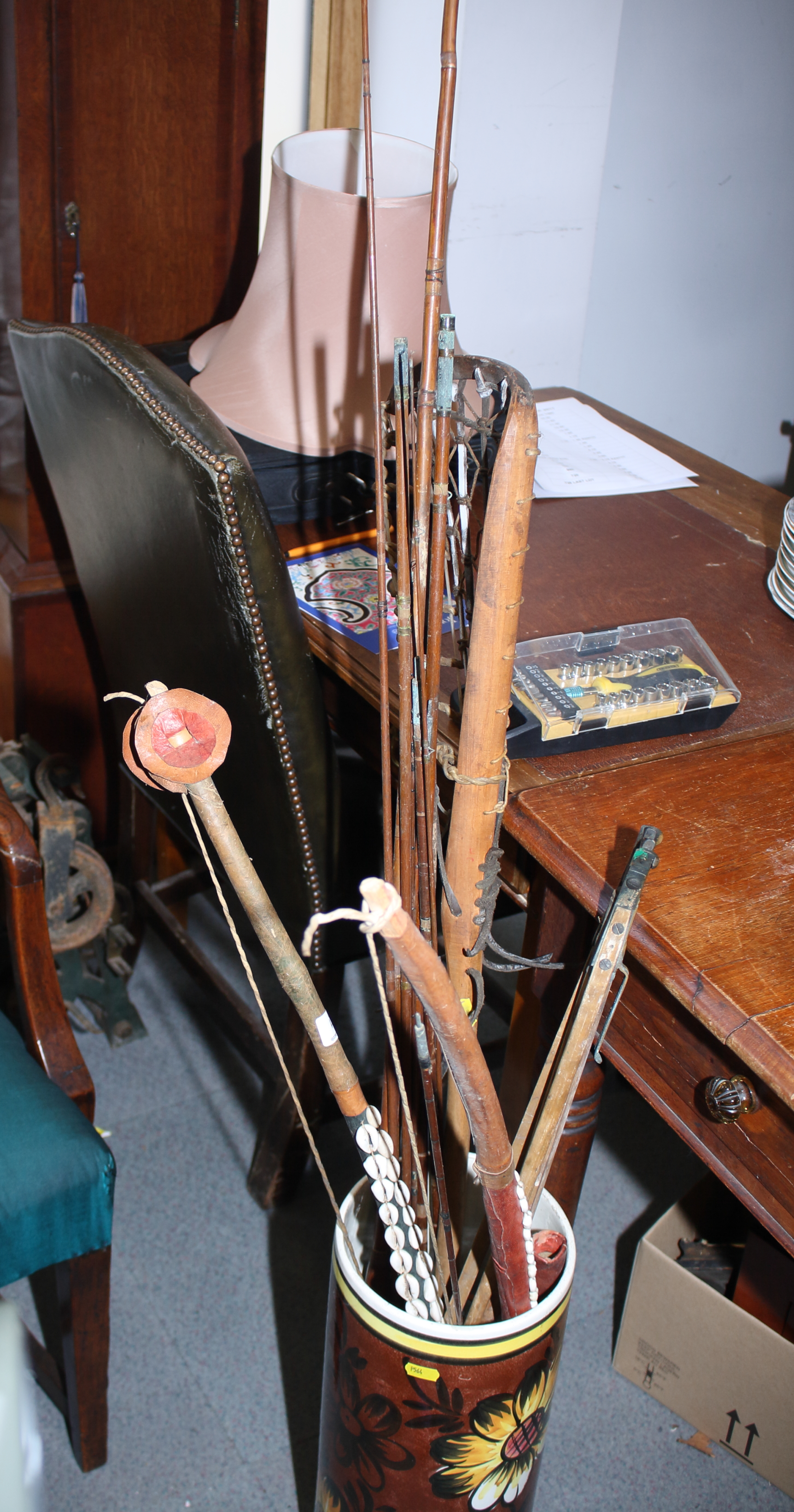 A three-section Hardy fishing rod (a/f), other rods, a landing net, a lacrosse stick, a bow, etc