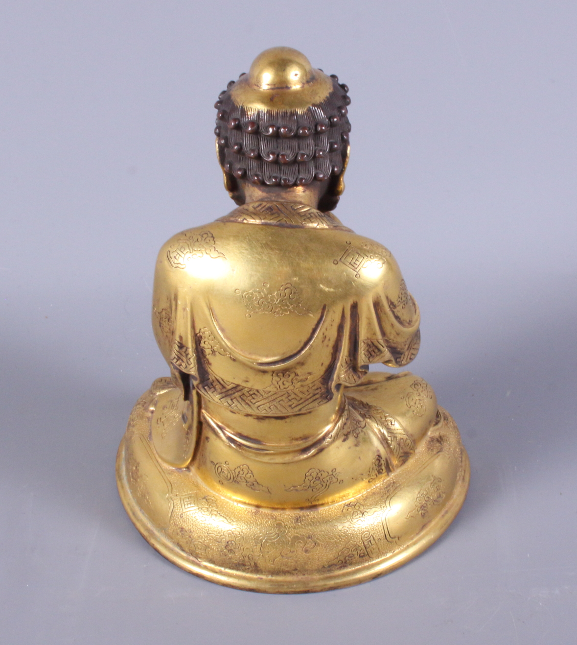 A late 19th century Chinese gilded figure of a crouching bearded man, engraved various Buddhist - Image 3 of 5