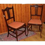 A pair of early 20th century carved mahogany bedroom chairs, on shaped and stretchered supports