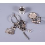 Two silver Albert watch chains, a silver pocket watch case, a silver decanter label and various