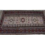 A Sumac rug with camel and animal design on a fawn ground, 72" x 41" approx