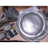 A collection of hammered pewter plates, trays, teasets, etc