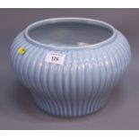 A Chinese pottery Claire de Lune glazed ribbed jardiniere, raised on an unglazed circular foot, 7