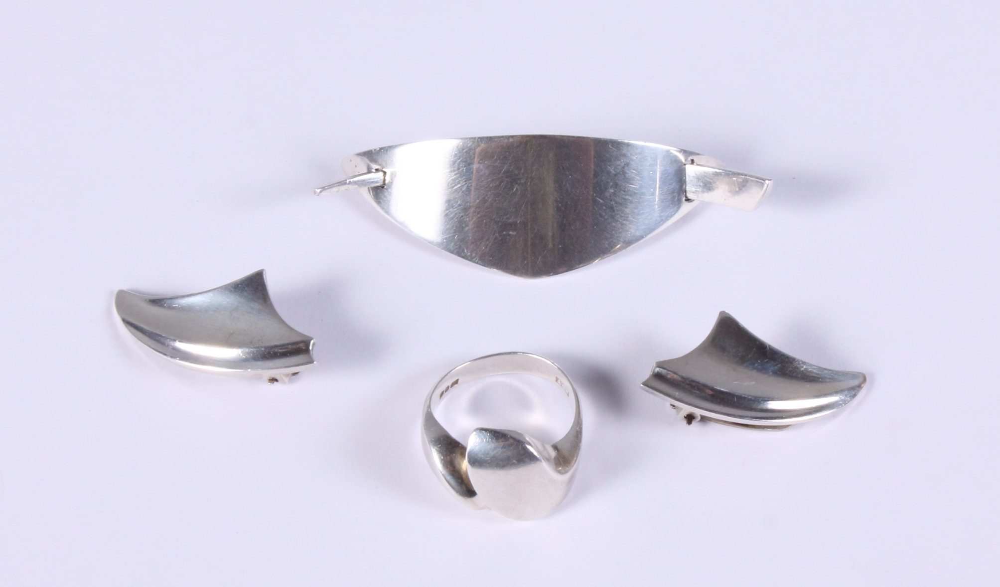 A Palle Bisgaard Denmark sterling silver brooch of abstract form, a similar pair of ear clips and