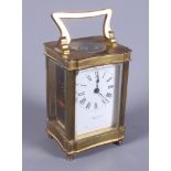 A French early 20th century brass carriage clock, retailed by Pridham & Sons, Torquay, with white