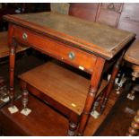 A 19th century walnut writing table with leather lined top, fitted one drawer, on turned and