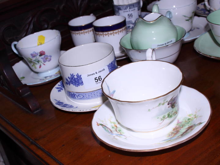 A collection of various English porcelain coffee cans and saucers, including Royal Worcester "Blue - Image 2 of 8