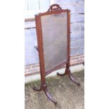 A 19th century mahogany cheval mirror with adjustable height and rotating trays, plate 19" x 31", on