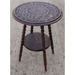 A 19th century chip carved walnut circular two-tier occasional table, on bobbin turned supports, 20"